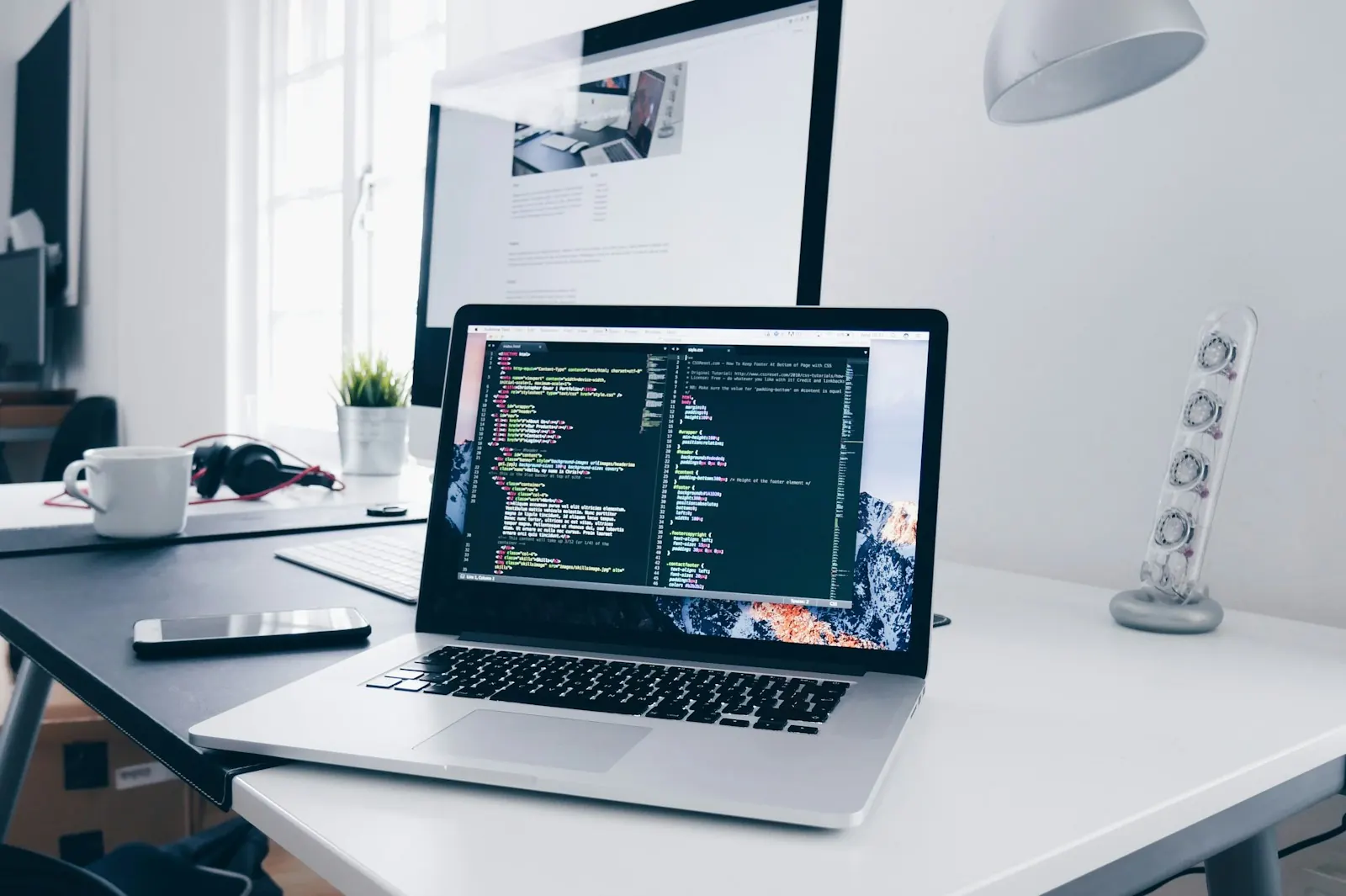 Laptop with code on a desk